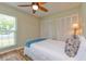 Bedroom with a ceiling fan, a window and ample closet space at 4997 Bostonian Loop, New Port Richey, FL 34655