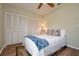 Bedroom with a ceiling fan and ample closet space at 4997 Bostonian Loop, New Port Richey, FL 34655