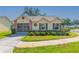 Charming single-story home with well-manicured lawn and mature landscaping in a quiet neighborhood at 4997 Bostonian Loop, New Port Richey, FL 34655