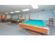 Game room with three billiards tables, comfortable seating, and a relaxing atmosphere at 4997 Bostonian Loop # 4997, New Port Richey, FL 34655