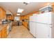 Well-equipped kitchen featuring stainless steel appliances, ample storage, and tile flooring at 4997 Bostonian Loop # 4997, New Port Richey, FL 34655