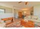 Inviting living room with wood floors and view into dining and kitchen areas at 4997 Bostonian Loop, New Port Richey, FL 34655