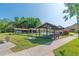 The shuffleboard courts are surrounded by lush landscaping with convenient benches for socializing and enjoyment at 4997 Bostonian Loop, New Port Richey, FL 34655