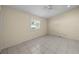 Bright bedroom featuring tile flooring and ample natural light at 5290 White Sand Ne Cir, St Petersburg, FL 33703