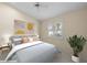 Bedroom featuring stylish decor, comfortable bed, and a bright window at 5290 White Sand Ne Cir, St Petersburg, FL 33703