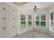 Bright breakfast nook area with custom cabinetry, plantation shutters, and tile flooring creating a cozy dining space at 5290 White Sand Ne Cir, St Petersburg, FL 33703