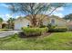 Charming single-story home boasts a well-manicured lawn and lush landscaping, creating excellent curb appeal at 5290 White Sand Ne Cir, St Petersburg, FL 33703