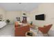 Staged living room features a modern design with vaulted ceilings, neutral tile, and stylish decor at 5290 White Sand Ne Cir, St Petersburg, FL 33703