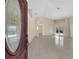Inviting living room features neutral paint, tile floors, with views of the pool through sliding doors at 5290 White Sand Ne Cir, St Petersburg, FL 33703
