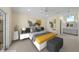 Staged main bedroom features vaulted ceilings, neutral paint, carpet, and a vanity/sink combo at 5290 White Sand Ne Cir, St Petersburg, FL 33703