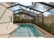 Screened-in pool with clear water, surrounded by a tiled patio and lush landscaping, offers a private outdoor retreat at 5290 White Sand Ne Cir, St Petersburg, FL 33703