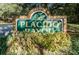 Welcoming community entrance sign with brick and lush greenery, inviting residents and guests to Placido Bayou at 5290 White Sand Ne Cir, St Petersburg, FL 33703