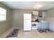 Cozy kitchen with white appliances and a window at 5401 E 14Th Ave, Tampa, FL 33619