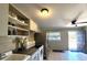 Bright kitchen featuring stainless steel appliances and tile flooring at 5401 E 14Th Ave, Tampa, FL 33619