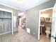 An open floor plan featuring a living room, kitchen, and bathroom at 5401 E 14Th Ave, Tampa, FL 33619