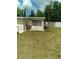 View of a backyard featuring a patio, barbeque, playset and an enclosed porch at 5443 Tangerine Dr, New Port Richey, FL 34652