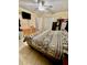 Large bedroom with a ceiling fan, TV, closet, and tile flooring at 5443 Tangerine Dr, New Port Richey, FL 34652