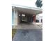 Carport area with a shed, providing covered parking and additional storage options at 5443 Tangerine Dr, New Port Richey, FL 34652