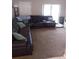 Spacious living room with comfortable seating and carpeted floors, perfect for relaxing at 5443 Tangerine Dr, New Port Richey, FL 34652