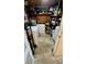 A cluttered storage room featuring shelving, appliances, and various stored items at 5443 Tangerine Dr, New Port Richey, FL 34652