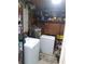 Practical storage room with appliances and shelving, ideal for laundry and household essentials at 5443 Tangerine Dr, New Port Richey, FL 34652