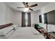 Bright bedroom with ceiling fan, TV, and window at 5942 Sweet Birch Dr, Riverview, FL 33578