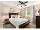 Bedroom with wood flooring, natural light, and neutral tones providing a peaceful retreat at 626 Marphil Loop, Brandon, FL 33511