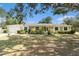 Charming one-story brick home with well-manicured landscaping and an attached garage at 626 Marphil Loop, Brandon, FL 33511