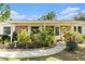 Charming home with a well-manicured front yard and colorful landscaping, enhancing curb appeal at 626 Marphil Loop, Brandon, FL 33511