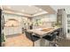Bright kitchen boasts white cabinets, tile floor, breakfast bar and modern appliances at 626 Marphil Loop, Brandon, FL 33511
