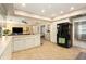 Expansive kitchen featuring an island with bar seating and seamless flow into the living area at 626 Marphil Loop, Brandon, FL 33511