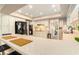Traditional-style kitchen featuring granite countertops, white cabinetry, and modern black appliances at 626 Marphil Loop, Brandon, FL 33511
