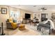 Cozy living room featuring stylish furniture, a ceiling fan, and neutral tones for a comfortable atmosphere at 626 Marphil Loop, Brandon, FL 33511