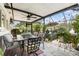 Comfortable outdoor covered patio featuring a ceiling fan, dining set, and potted plants at 626 Marphil Loop, Brandon, FL 33511