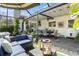 Screened outdoor patio with seating, plants, and ceiling fan, perfect for entertaining at 626 Marphil Loop, Brandon, FL 33511