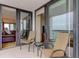 Relaxing condo balcony with seating and sliding glass doors to living area at 6265 Sun Blvd # 805, St Petersburg, FL 33715