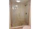 Modern bathroom with glass shower, mosaic tile floor, and updated fixtures, offering a sleek and clean design at 6265 Sun Blvd # 805, St Petersburg, FL 33715