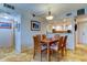 Open-concept dining room showcasing a view into the bright, adjacent kitchen at 6265 Sun Blvd # 805, St Petersburg, FL 33715
