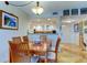 Open-concept dining room showcasing a view into the bright, adjacent kitchen at 6265 Sun Blvd # 805, St Petersburg, FL 33715