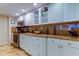 Bright kitchen features marble countertops, sleek white cabinetry and stainless steel appliances at 6265 Sun Blvd # 805, St Petersburg, FL 33715