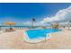 Inviting pool area featuring lounge chairs and umbrellas for residents at 6265 Sun Blvd # 805, St Petersburg, FL 33715