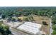 An aerial view of a park with sports facilities in a lush, green neighborhood at 6709 N 13Th St, Tampa, FL 33604