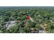 An aerial view of a lush, green neighborhood with tree-lined streets at 6709 N 13Th St, Tampa, FL 33604
