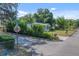 Cozy single-story home featuring a well-maintained lawn and vibrant foliage at 6709 N 13Th St, Tampa, FL 33604