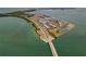 Aerial view of Honeymoon Island condos complex near a bridge and the ocean at 7 Island Park Pl # 204, Dunedin, FL 34698