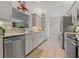 Updated kitchen with stainless steel appliances, ample cabinet space, and modern finishes at 7 Island Park Pl # 204, Dunedin, FL 34698