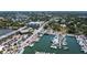 Scenic marina view featuring docked boats, waterfront condos and nearby parking at 7 Island Park Pl # 204, Dunedin, FL 34698