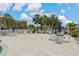 Expansive pool deck area with ample lounge chairs and tables for residents to enjoy the outdoors at 7 Island Park Pl # 204, Dunedin, FL 34698