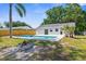The backyard offers a pool, a fire pit and privacy at 7050 Jenner Ave, New Port Richey, FL 34655