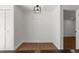 Versatile room featuring shiplap, and wood flooring, adjacent to living spaces at 7050 Jenner Ave, New Port Richey, FL 34655